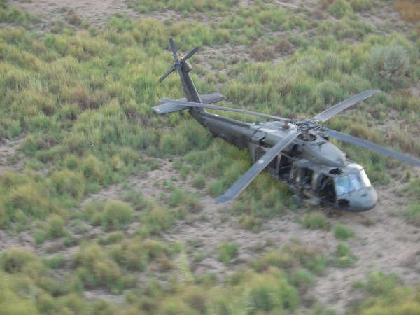 Black Hawk helicopter in field.