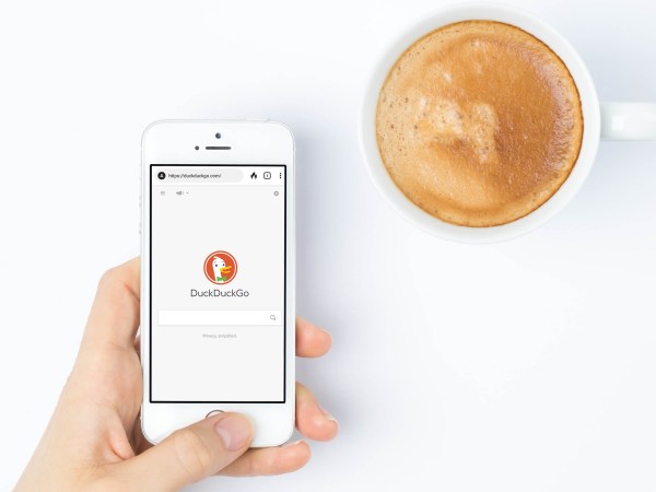 hand holding iphone with duckduckgo app