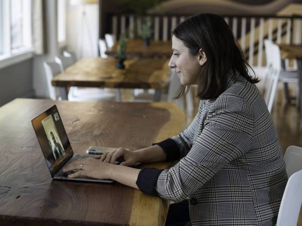 Person sitting at a table on a Zoom call