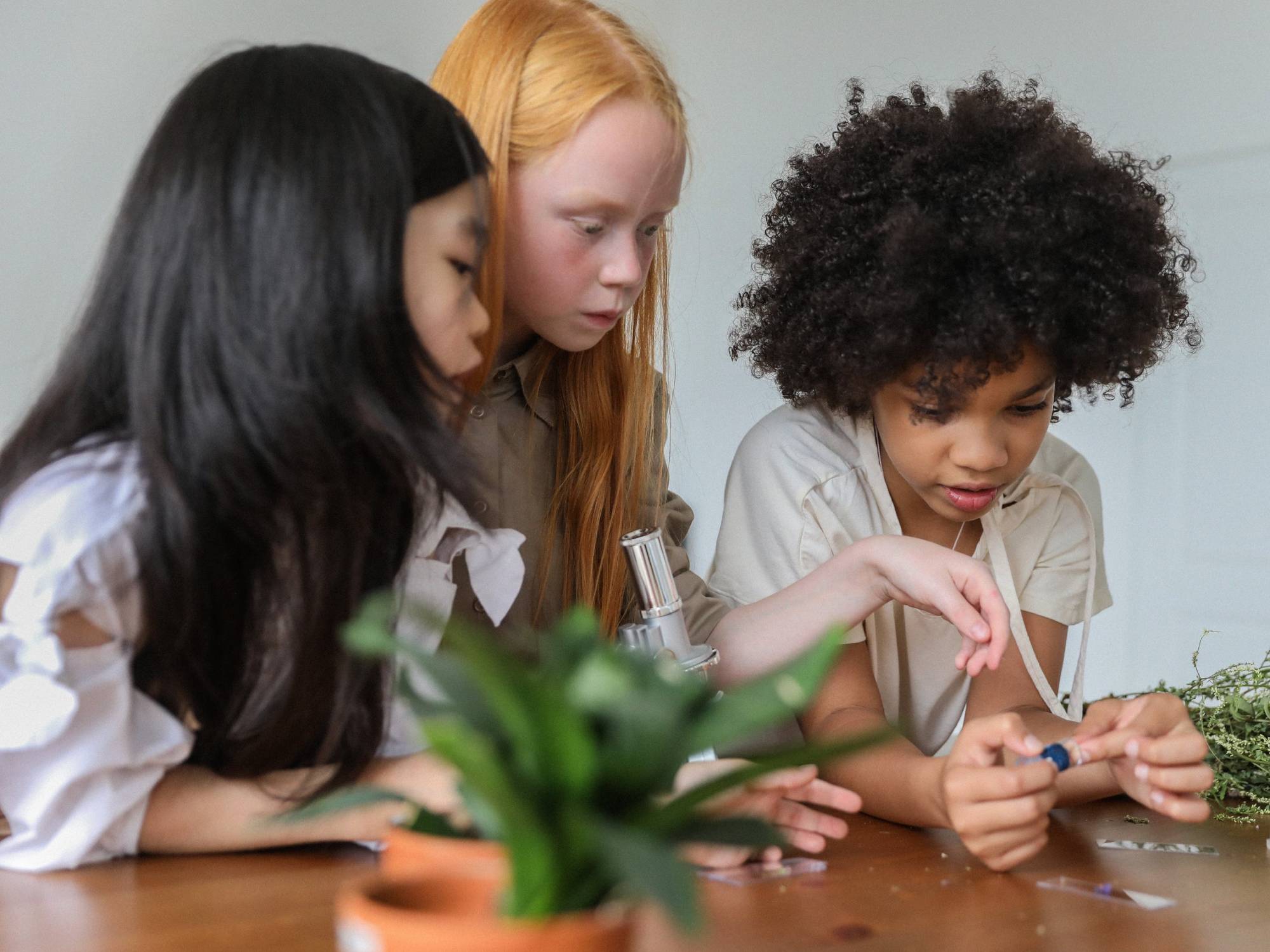 Children playing with microscope