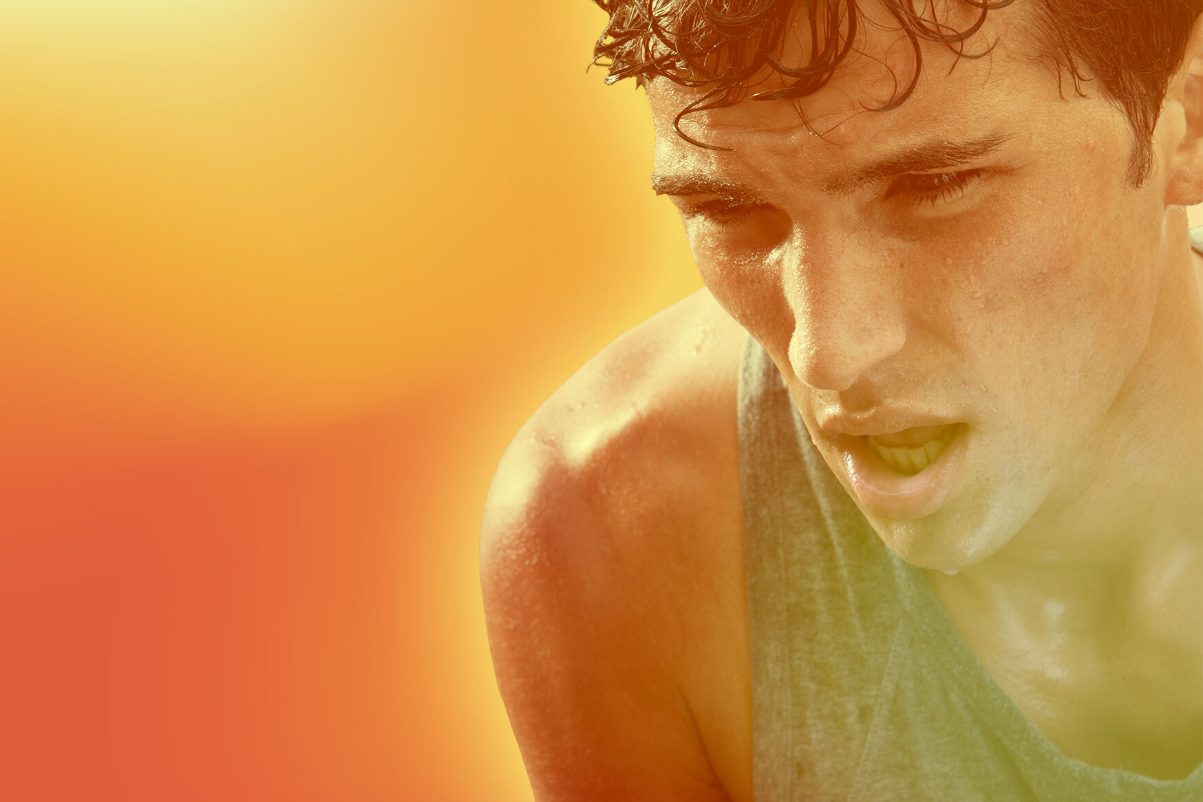 a sweaty man pants for air over an orange and yellow background