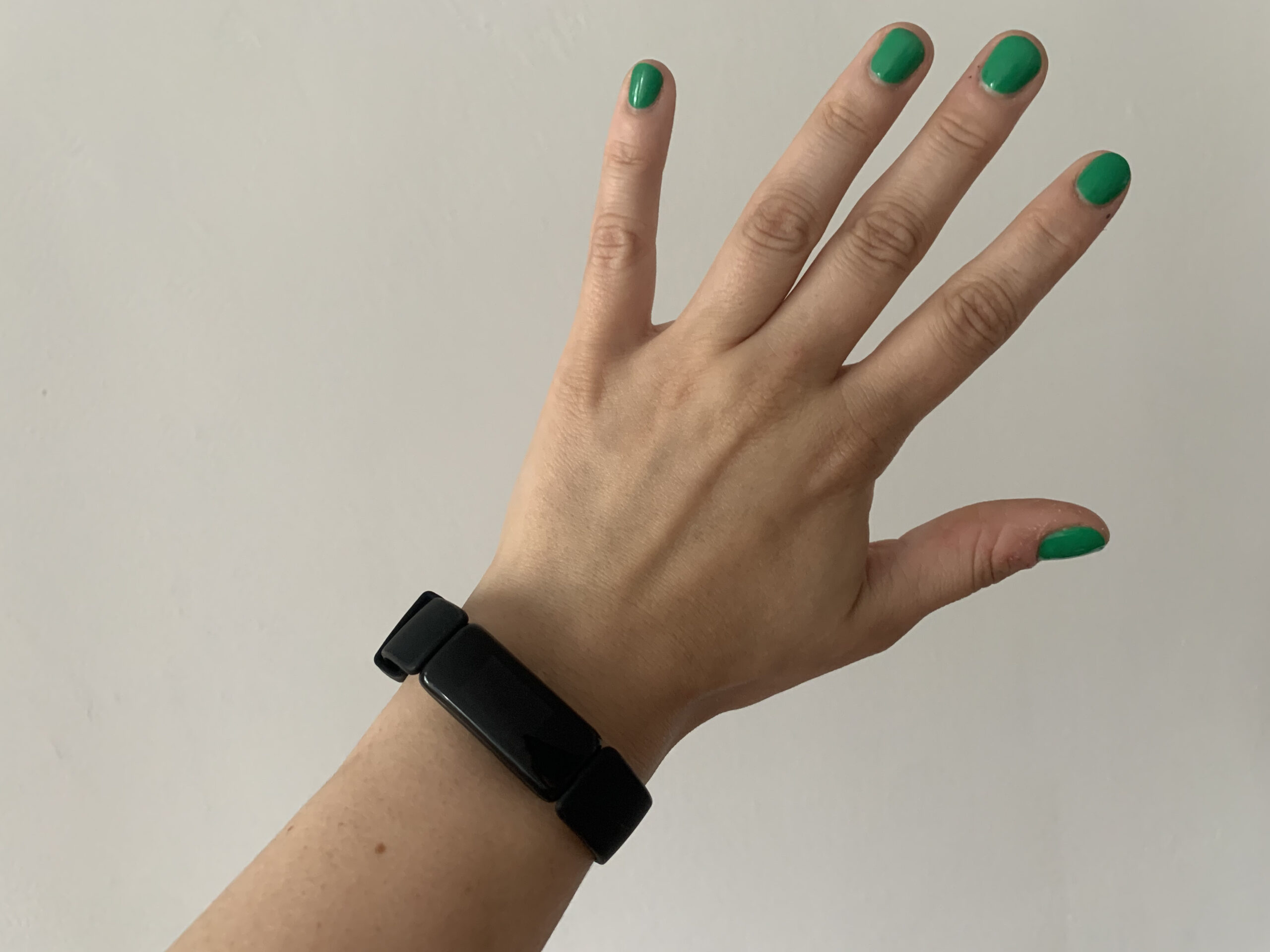 hand wearing fitbit inspire 2