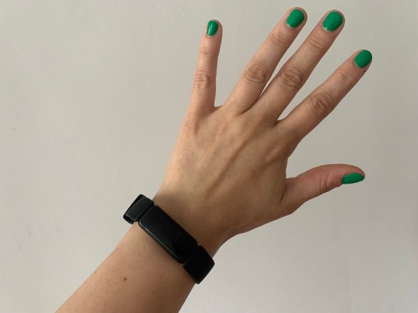  hand wearing fitbit inspire 2