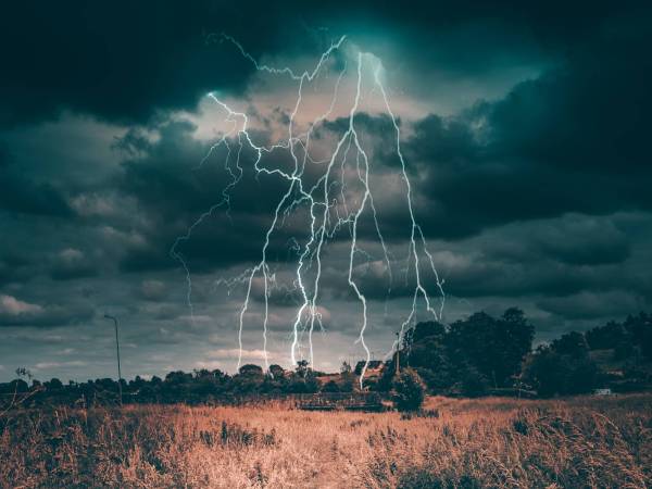 lightning bolt in the middle of the countryside