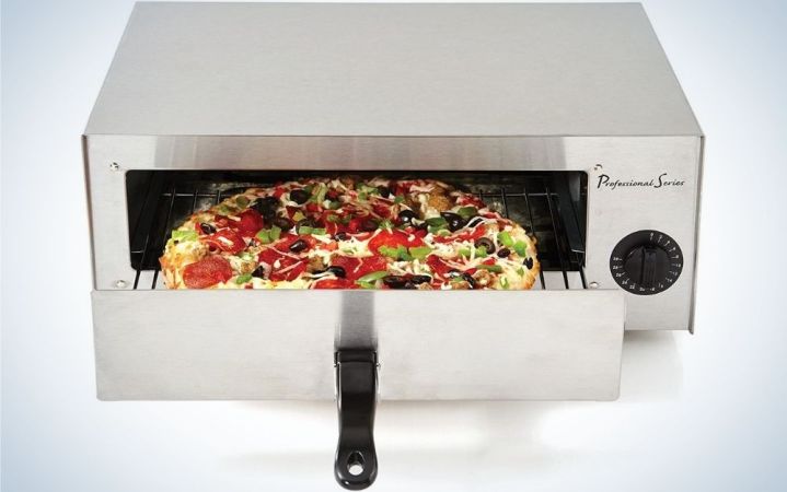  A copper and oven for silver pizza and rectangular shape and inside it with a grill in which there is a pizza.