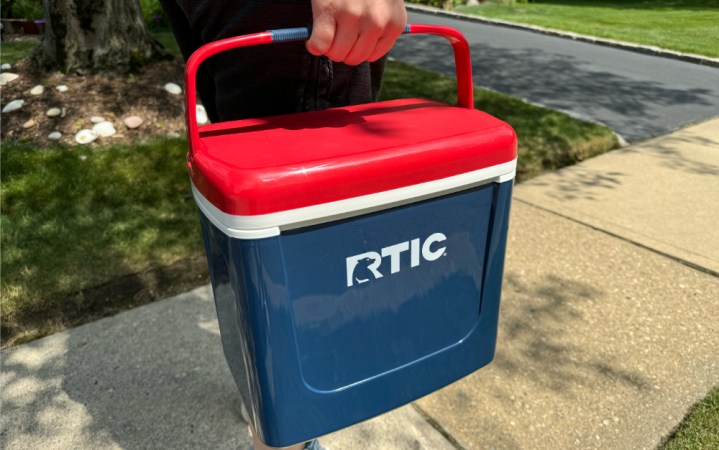  RTIC Road Trip cooler being held.