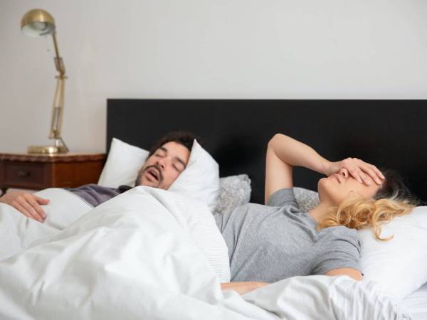 Frustrated couple in bed