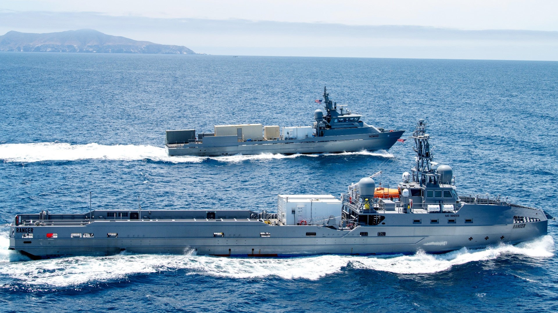 Two US Navy ships on the ocean