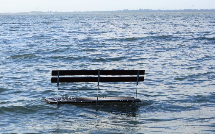 flood waters surrounding a bench