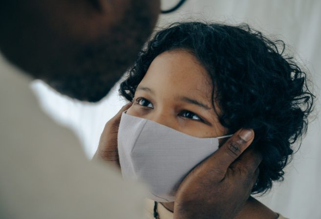 Child wearing gray facemask