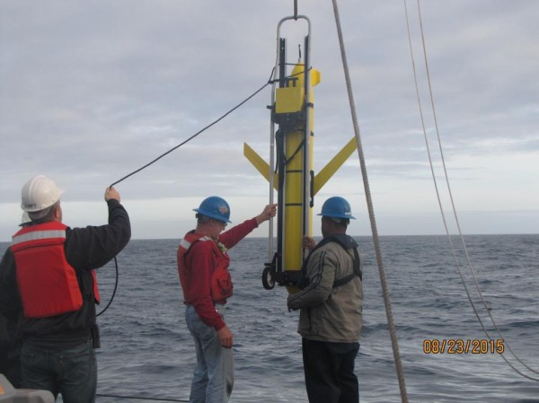 an undersea drone being lowered into the water