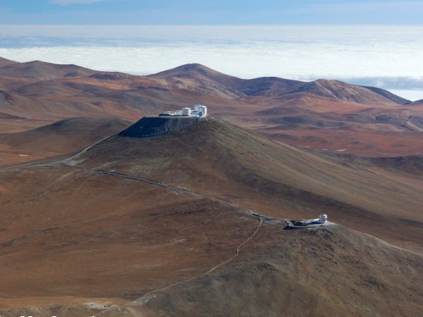 Aerial view of Paranal with VISTA in the foreground and the Very Large Telescope in the background.