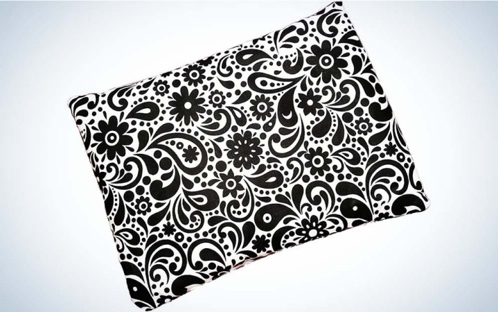  A black-and-white flowered print design on the cover of a heating pad made by Caylee's Creations.