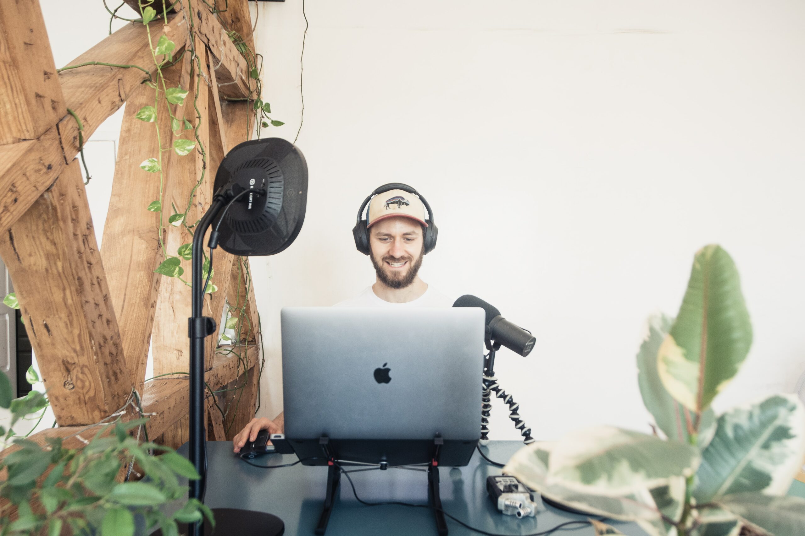 Man at laptop with a Shure SM7B mic