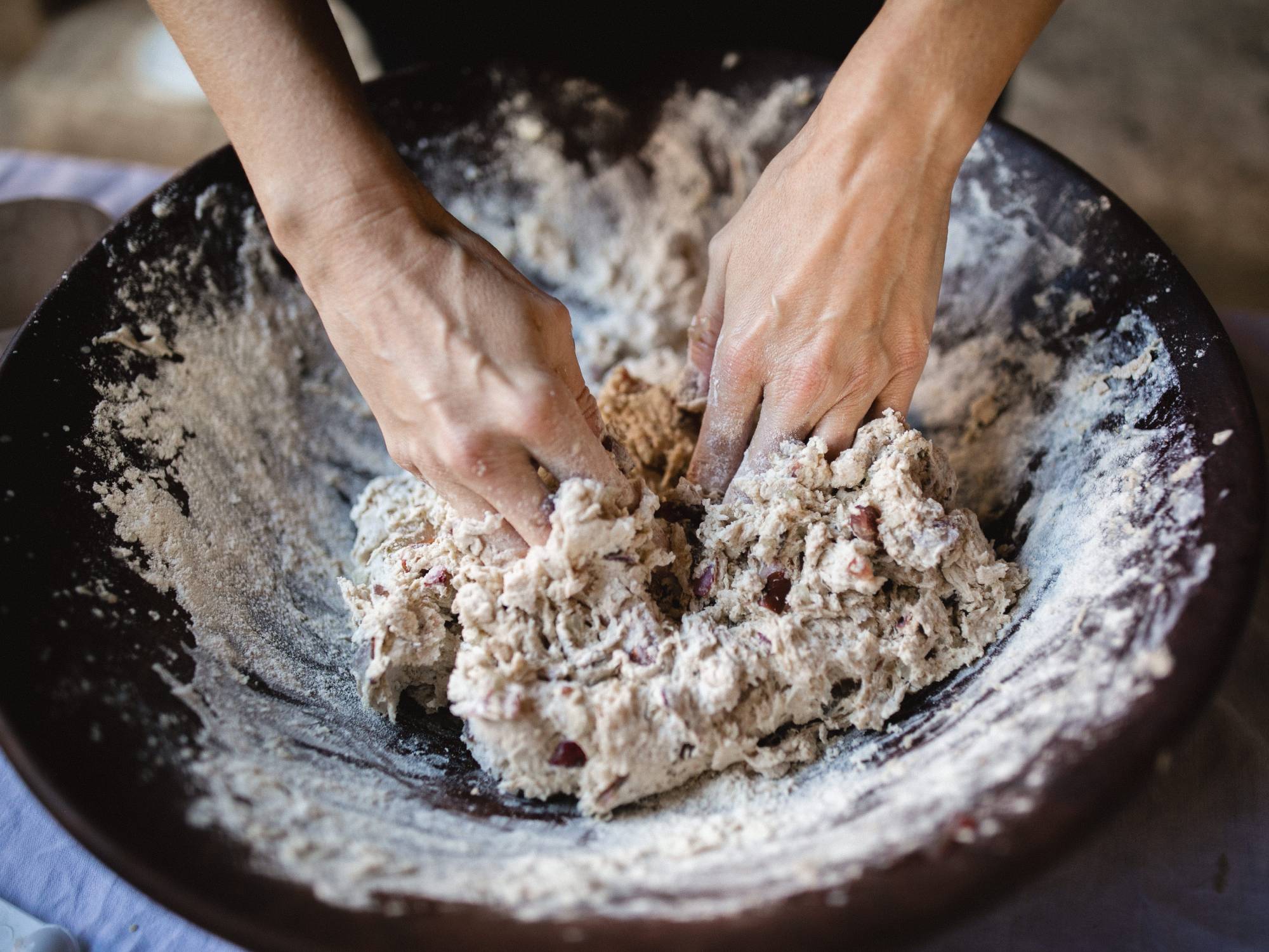 Hands kneading bread dough