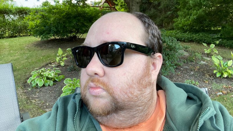  A man wearing Ray-Ban stories sunglasses in a garden