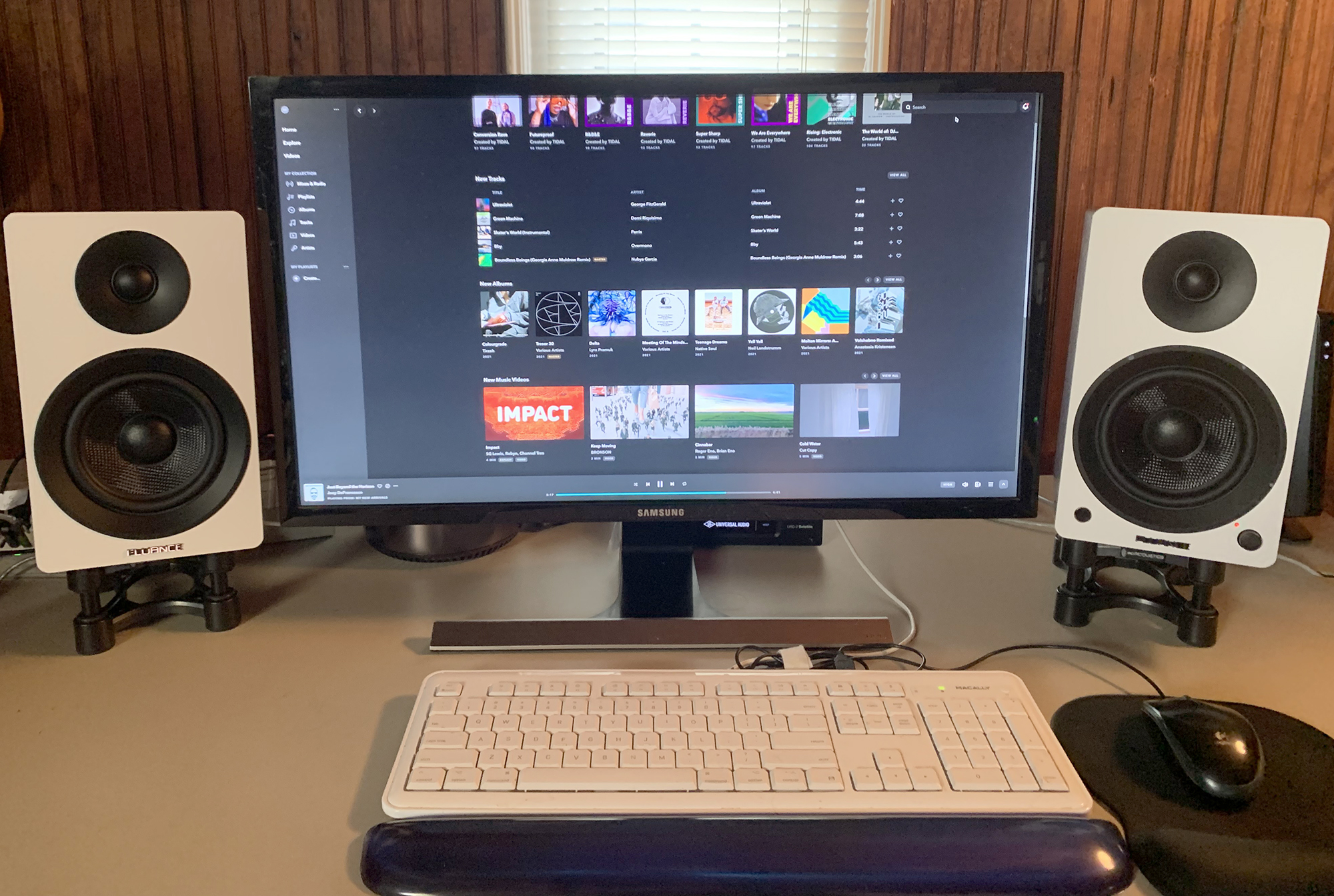 Fluance Ai41 speakers next to a computer monitor