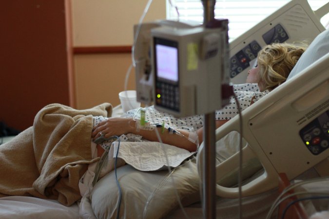 women in hospital bed