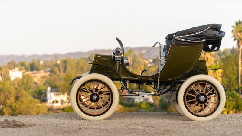 The early EV the 1908 Columbia Electric Victoria Phaeton on a hilly street