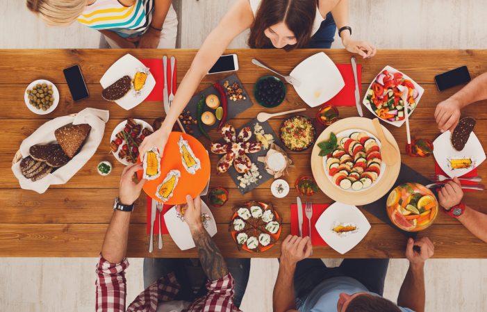 Thanksgiving dinner party with smartphones on the table