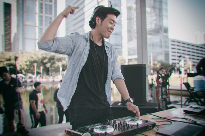 DJ in blue buttondown and black t-shirt