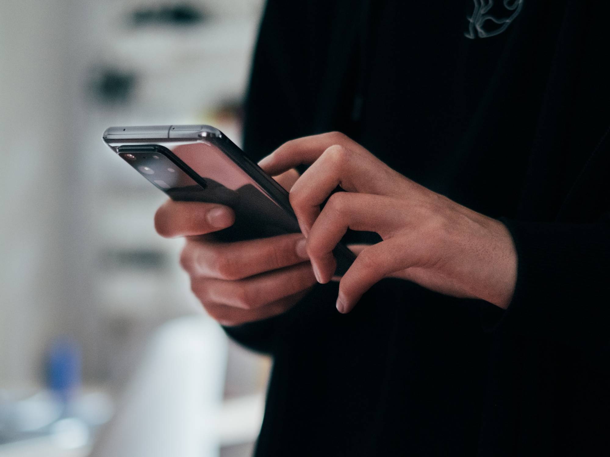 person holding phone in their hands