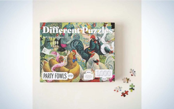  A puzzle box for the Party Fowls puzzle, featuring brightly colored chickens with some puzzle pieces in the foreground.