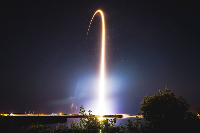 a rocket launching at night