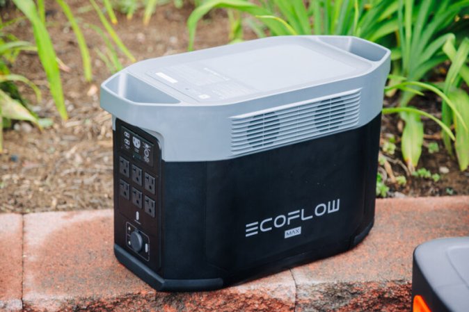  EcoFlow Delta 2 Max solar generator sitting on a wall