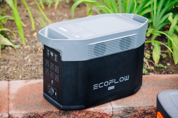  EcoFlow Delta 2 Max solar generator sitting on a wall