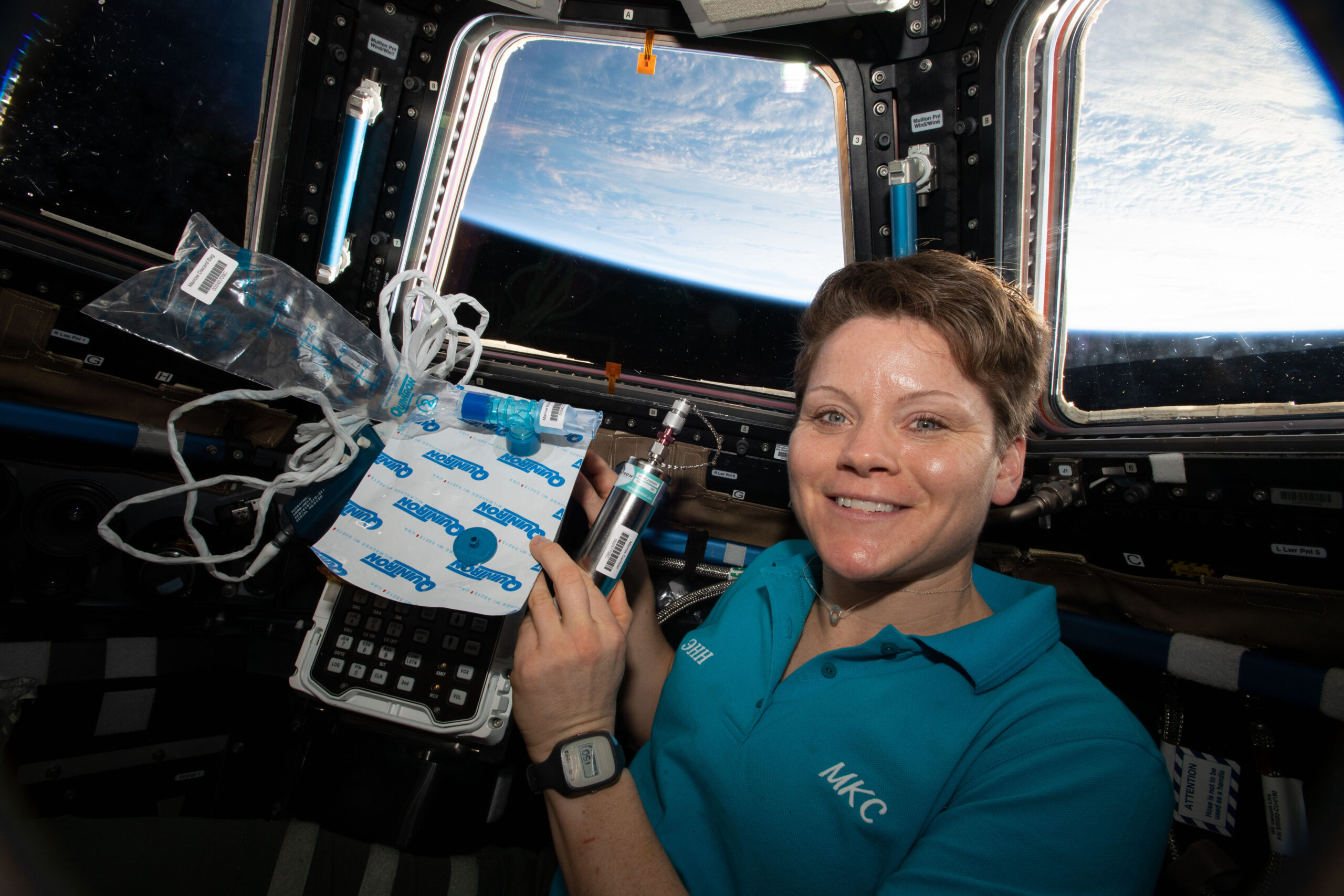 a female astronaut holding a medical sample collection bags and tubes, floating in zero gravity in a space station. through the windows you can see earth