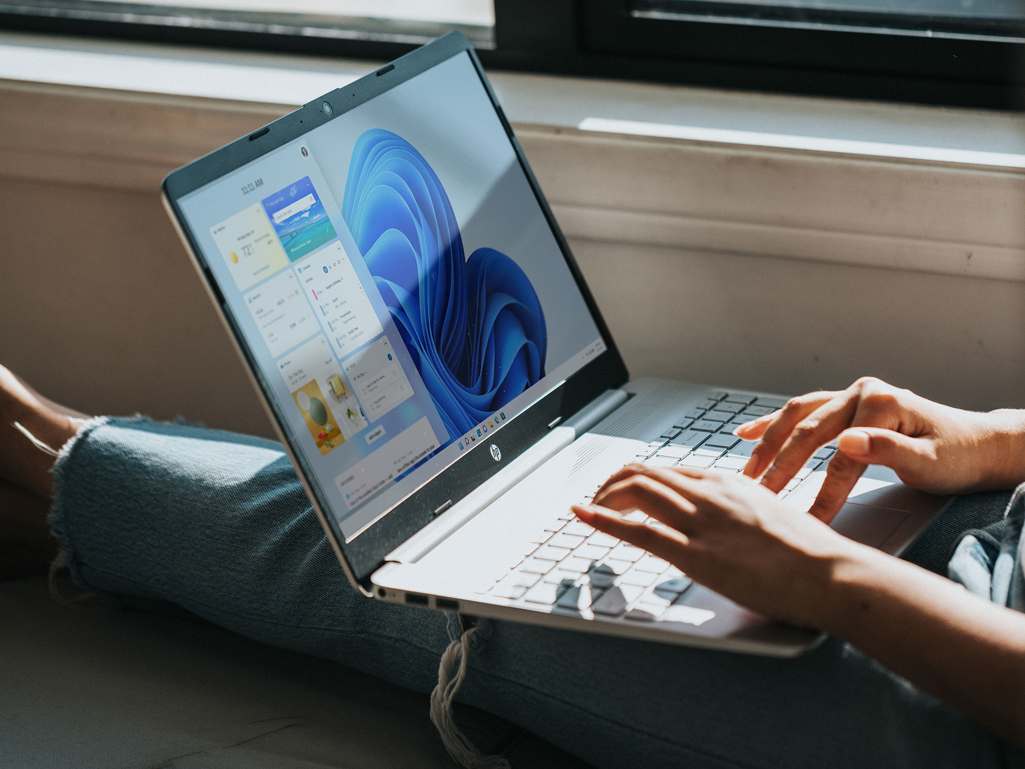 person on laptop using windows