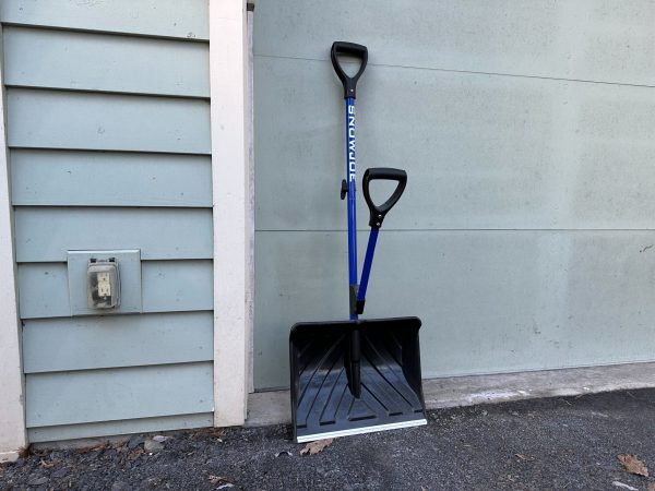  Blue Snow Joe Shovelution shovel leaning against a house