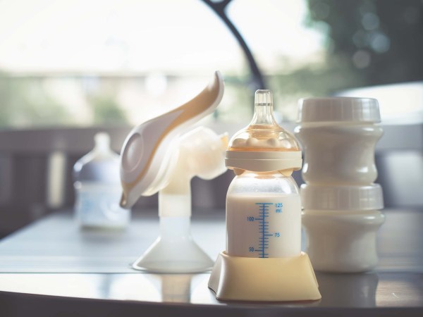 bottle and breast pump on a desk