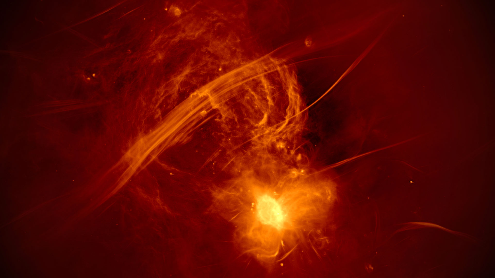 Red and yellow spherical cloud above bright yellow dot (black hole) and yellow diagonal streaks (non-thermal filaments).