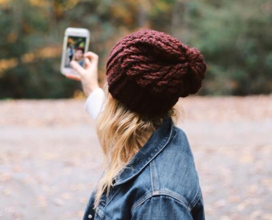 a woman taking a selfie