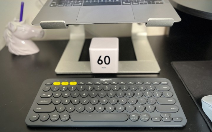  A Logitech K380 on a black desk.