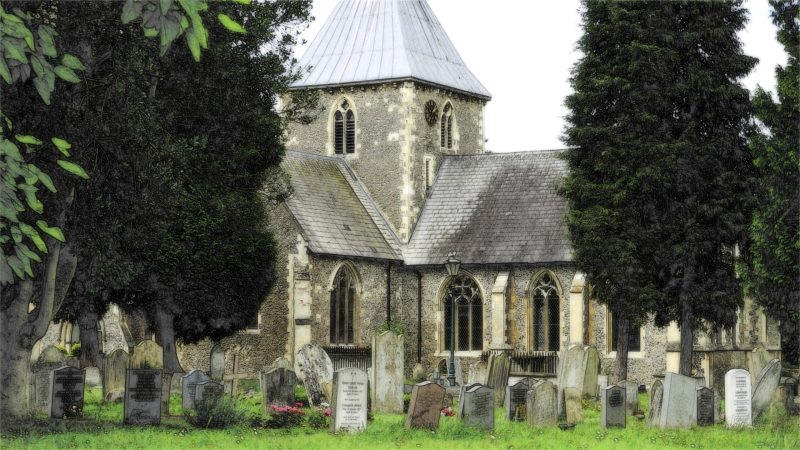 Cemetary with large stone chapel and headstones.