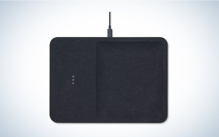  A charcoal linen wireless charging station on a blue and white background