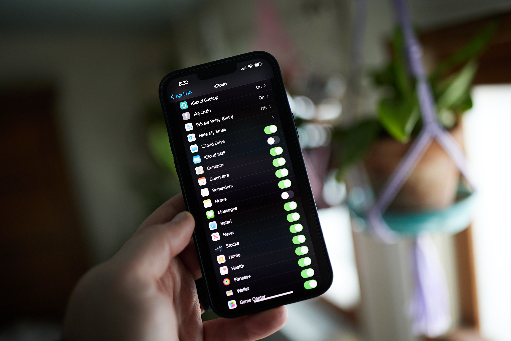 A picture of an iPhone 13 Pro Max on the settings screen for iCloud backup