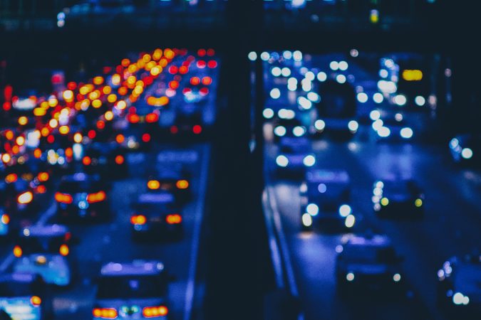 blurred photo of car traffic on the interstate highway