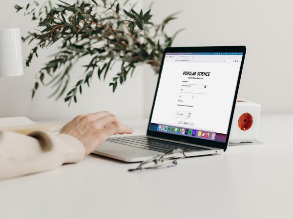 person on laptop signing up to popsci newsletter