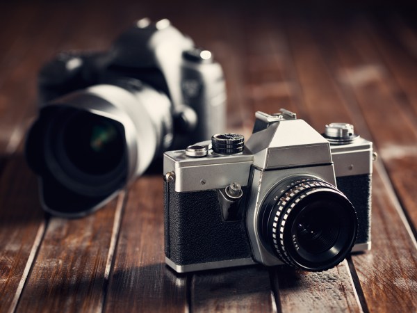 Photo of a film and DSLR camera.