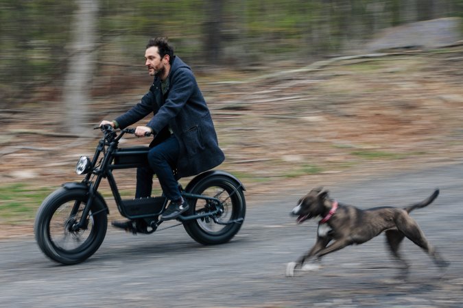  Ride1up Revv 1 bike ridden next to a running dog