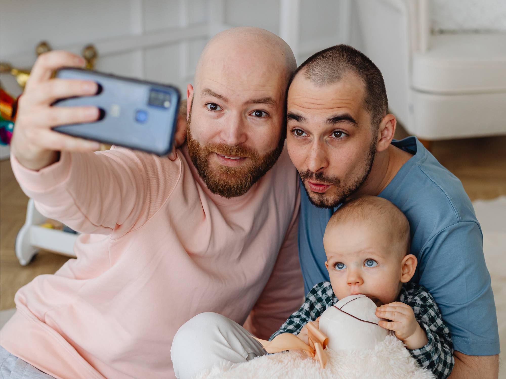 couple with baby taking selfie