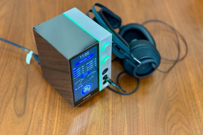  A very reflective FiiO R9 on a wood table playing Billy Caden's "Alligator" on Austrian Audio Composer headphones.