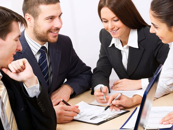 people sitting around a table stack commerce