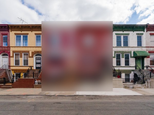 A row of houses on a street, with two in the middle blurred out.