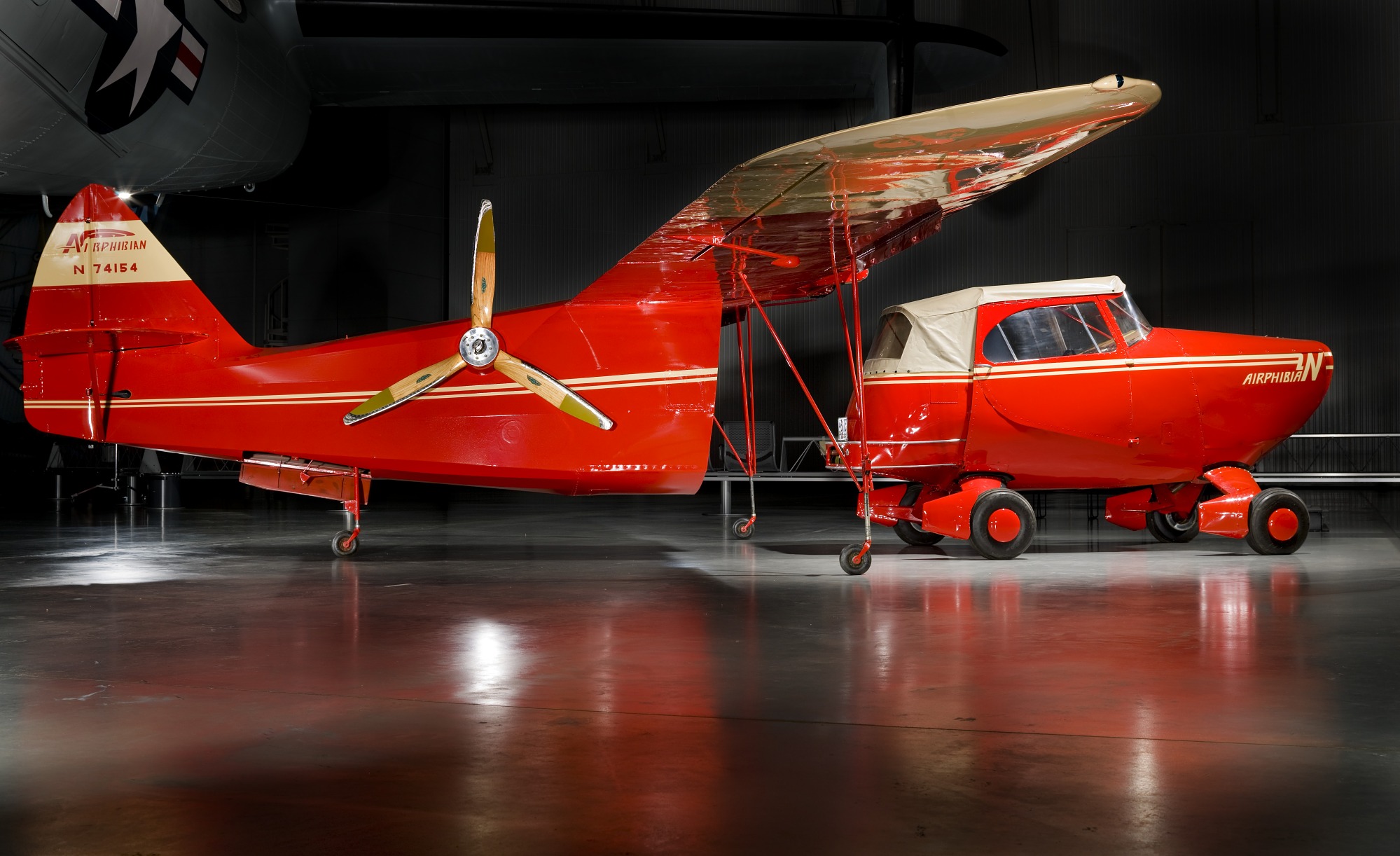 a bright red plane with tannish gold trim. the plane's back end and wings can be separated from the front of the cockpit, which is alternatively a car