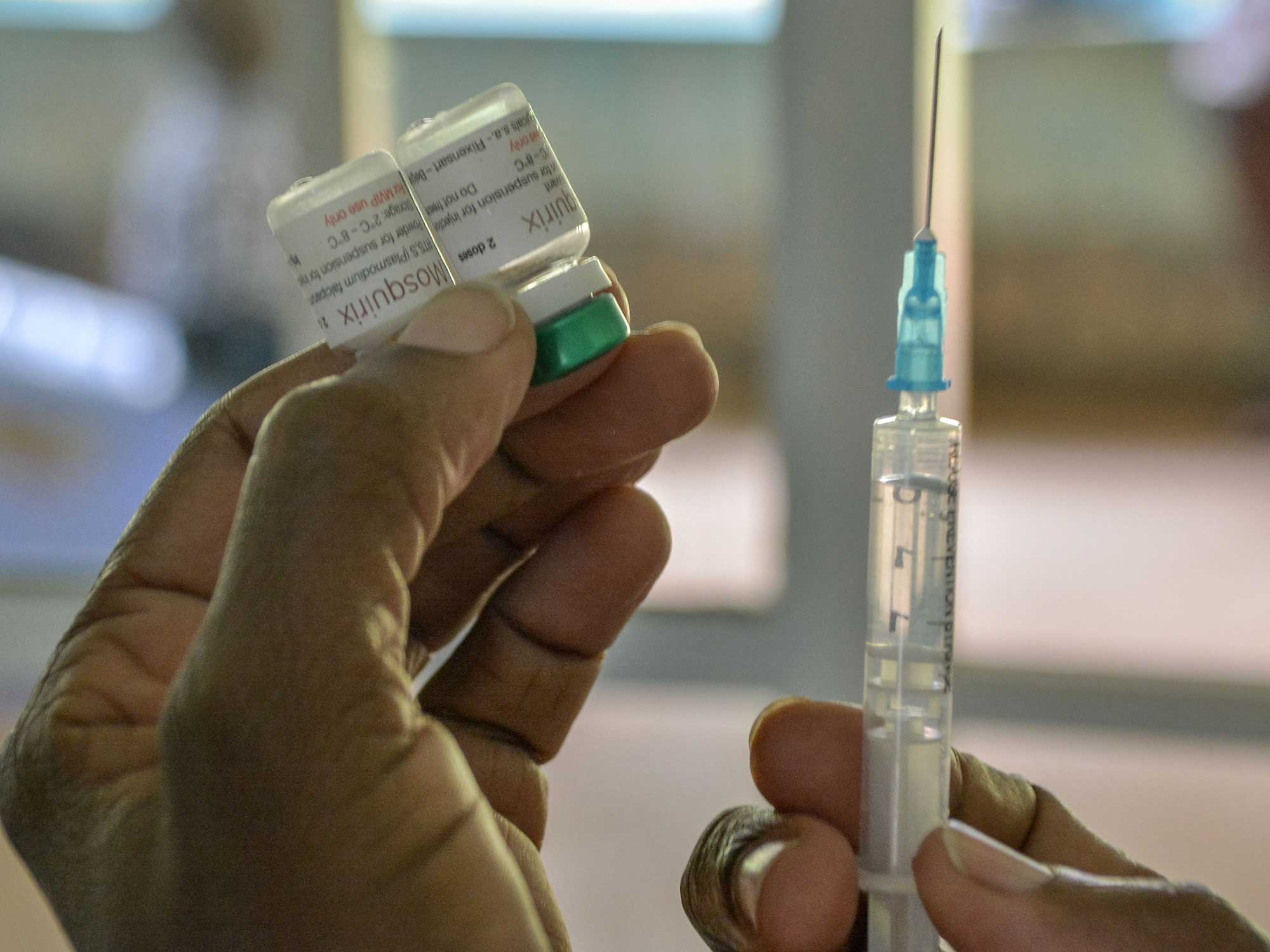 A health worker prepares a malaria vaccination for a child at Yala Sub-County hospital, in Yala, Kenya, on October 7, 2021.